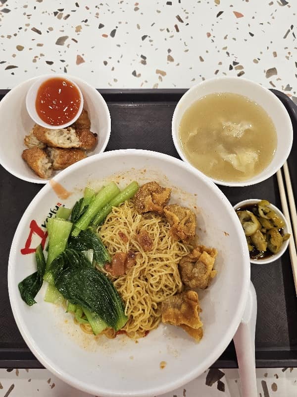 Customer not told in advance that KKH wanton mee stall had no char siew, offered voucher