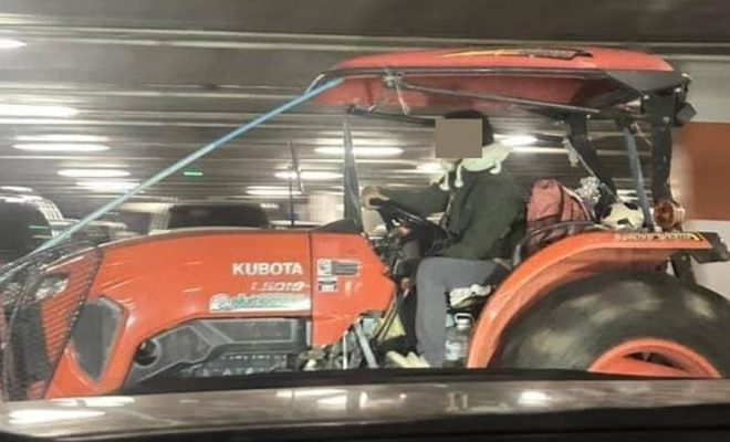 Man drives tractor mall