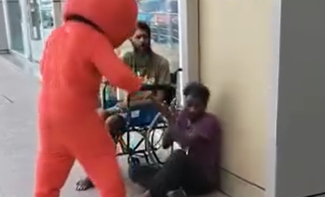Elmo mascot assault 1