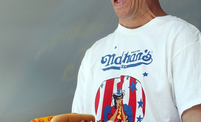 Hot dog eating champion in US partners with plant-based brand, gets banned from contest